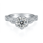 CARISSIE round moissanite solitaire ring, front profile highlighting the brilliant center stone and ribbon-style shoulders