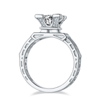CARISSIE round moissanite solitaire ring, side profile revealing open-work geometric shank design and textured metal details