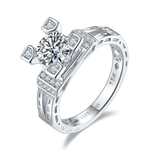 CARISSIE round moissanite solitaire ring, angled view showing lattice band with frosted inserts and square prong settings