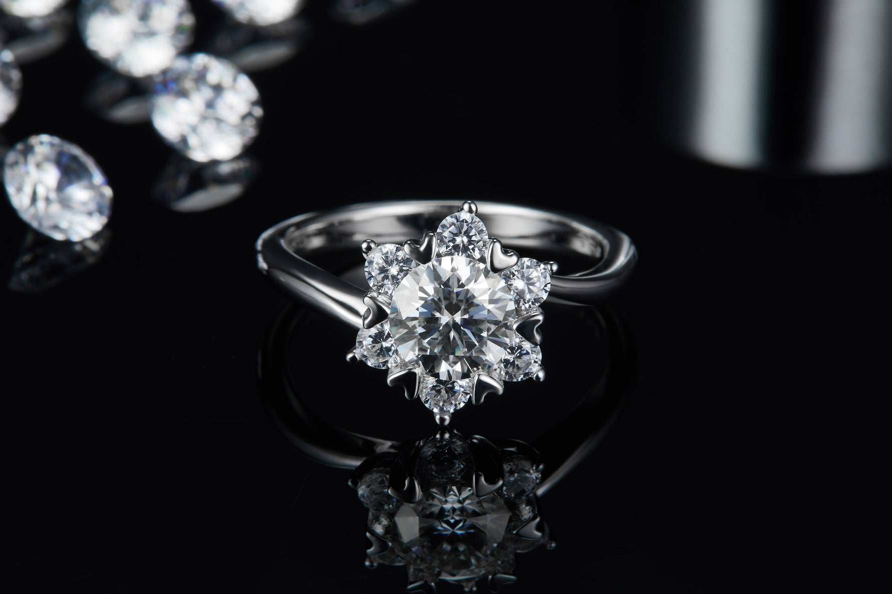 CARISSIE round moissanite cluster ring, front view with reflection on glossy background showcasing stone brilliance