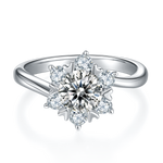 CARISSIE round moissanite cluster ring, top-down view showing the floral arrangement of stones on a polished silver band