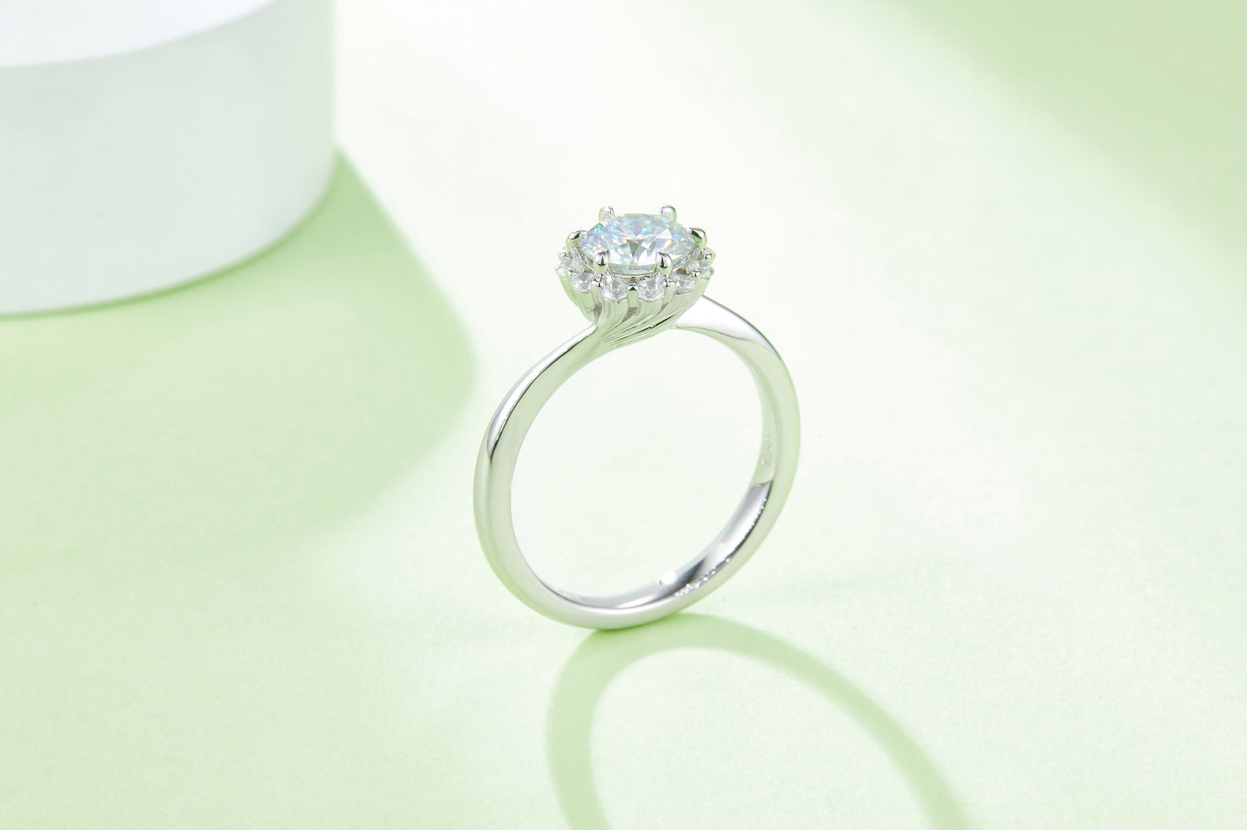 CARISSIE round moissanite halo engagement ring, standing side angle emphasizing the height of the head and split shank design