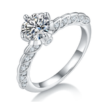 CARISSIE round moissanite solitaire ring, angled side view showing twisted vine band with pave-set accent stones
