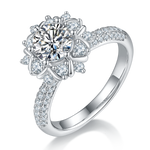 CARISSIE round moissanite cluster engagement ring, angled view highlighting floral prongs and pavé band