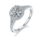 CARISSIE round moissanite halo engagement ring, angled view highlighting split shank and pavé band details