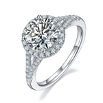 CARISSIE round moissanite halo ring, angled view highlighting the brilliant center stone and pavé split shank band