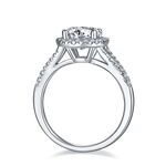 CARISSIE round moissanite halo ring, side profile revealing the open gallery design and accent stones on the band