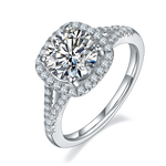 CARISSIE round moissanite halo engagement ring, angled view highlighting split shank with pavé stones and cushion-shaped halo
