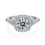 CARISSIE round moissanite halo engagement ring, top-down view displaying four-prong setting and surrounding diamond accents