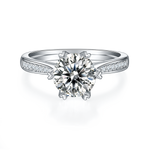 CARISSIE round moissanite solitaire ring, direct front view highlighting six-prong setting and symmetrical pave shoulders