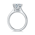CARISSIE round moissanite solitaire ring, side profile revealing smooth inner band surface and tapered silver-tone metal design