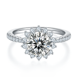 CARISSIE round moissanite halo engagement ring, top-down view showcasing the radiant sunburst halo surrounding the center stone.