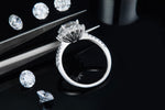 CARISSIE round moissanite halo engagement ring, detailed close-up of the gallery rail and inner band craftsmanship.