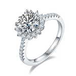 CARISSIE round moissanite halo engagement ring, side profile view highlighting the split shank band and pavé-set accent stones.