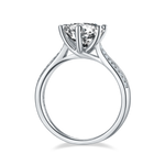 CARISSIE round moissanite solitaire ring, side profile revealing the elegant curve of the silver-tone metal band