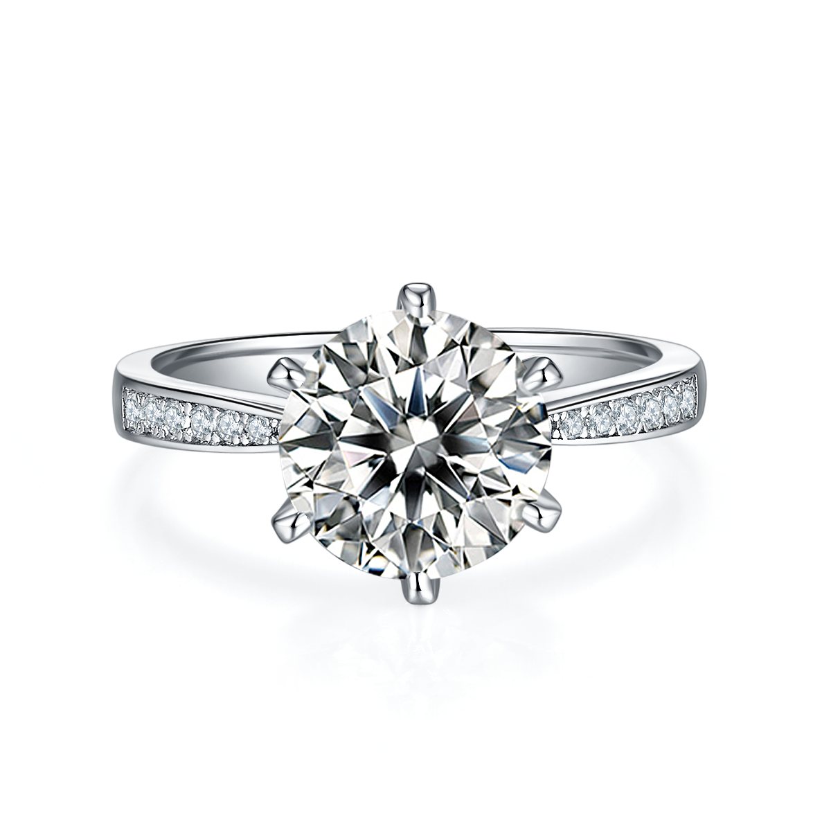 CARISSIE round moissanite solitaire ring, top-down view showcasing the six-prong setting and pave accents on both shoulders.