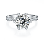 CARISSIE round moissanite engagement ring, front view displaying brilliant-cut center stone and silver-tone metal setting