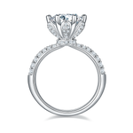 CARISSIE round moissanite engagement ring, side profile displaying the gallery's pavé accents and smooth inner shank