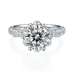 CARISSIE round moissanite engagement ring, front view showing brilliant center stone and flower petal prong details