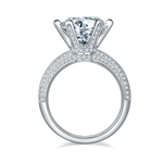 CARISSIE round moissanite ring, side profile displaying the gallery rail diamonds and smooth inner band