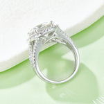 CARISSIE round moissanite halo engagement ring, side profile revealing the openwork crisscross gallery design under the head