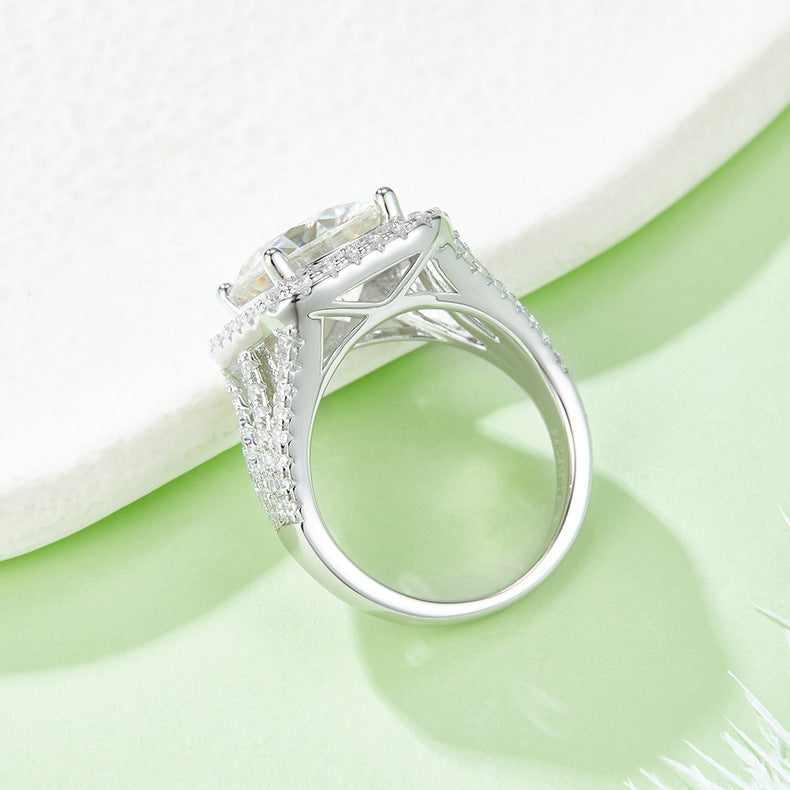 CARISSIE round moissanite bridal ring, profile shot showing the smooth inner band and detailed under-gallery structure