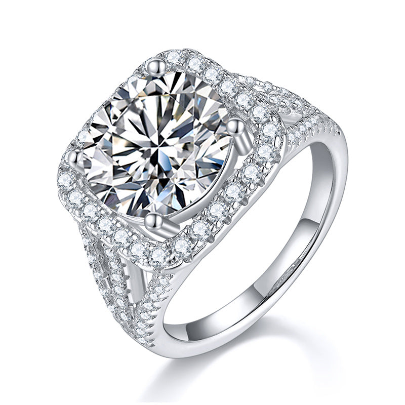CARISSIE round moissanite halo ring, angled view highlighting the brilliant center stone and split shank band