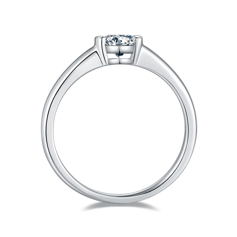 CARISSIE round moissanite engagement ring, side profile displaying the sleek band tapering into the modern bezel head