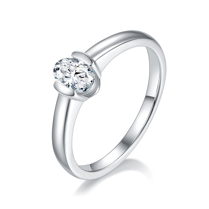 CARISSIE oval moissanite bezel ring, angled view showing the polished silver-tone band and secure metal rim