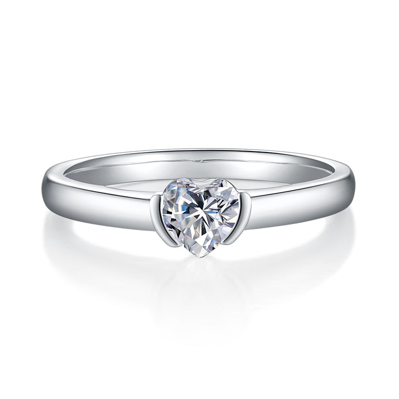 CARISSIE heart moissanite bezel ring, front view showing the smooth metal rim encasing the sparkling center gem.