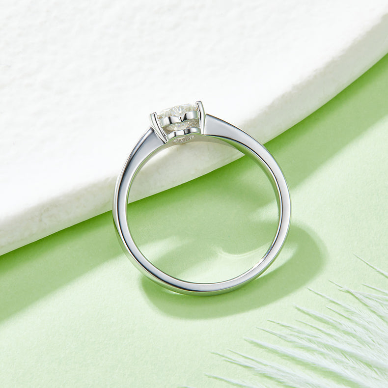 CARISSIE heart moissanite bezel ring, elevated rear view revealing the interior gallery and clean silver finish.