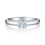 CARISSIE emerald cut bezel engagement ring, front view displaying the geometric step-cut center stone in polished metal