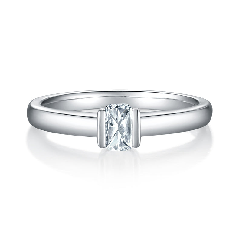 CARISSIE emerald cut bezel engagement ring, front view displaying the geometric step-cut center stone in polished metal