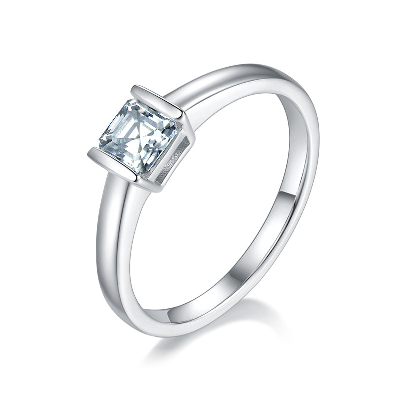 CARISSIE Asscher bezel engagement ring, angled view highlighting the square-cut stone and polished silver-tone band.