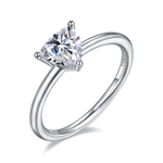 CARISSIE trillion solitaire engagement ring, angled view highlighting the high-polish silver band and three-prong setting