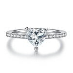 CARISSIE heart solitaire engagement ring, front profile view highlighting the center stone symmetry and pave-set diamond band