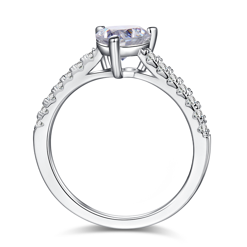 CARISSIE heart solitaire engagement ring, top-down view revealing the open gallery design and prong structure beneath the gem
