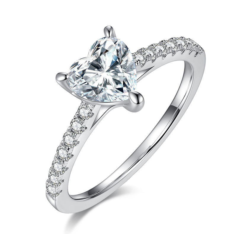 CARISSIE heart solitaire engagement ring, angled side view showing split shank band with pavé accents and three-prong setting