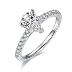 CARISSIE pear moissanite pavé ring, angled view highlighting the brilliant center stone and V-shaped prong detail