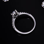 CARISSIE pear moissanite pavé ring, top-down angle showing the elegant curve of the band and secure setting