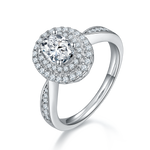 CARISSIE oval moissanite halo engagement ring, angled view highlighting double halo and split shank with channel-set stones