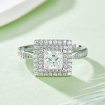 CARISSIE princess halo engagement ring, direct top-down view emphasizing symmetrical square halo setting