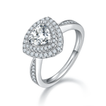 CARISSIE trillion halo engagement ring, angled view highlighting the split shank band and pavé-set diamonds on the shoulders