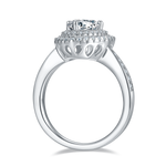 CARISSIE trillion halo engagement ring, side profile revealing the openwork gallery with teardrop cutouts beneath the head