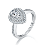 CARISSIE pear moissanite halo ring, angled view highlighting split shank band and pavé accents on shoulders