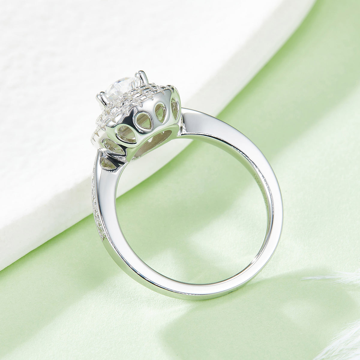 CARISSIE pear moissanite halo ring, side angle revealing under-gallery details and elegant band curvature