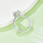 CARISSIE trillion halo engagement ring, side profile revealing the gallery accent stone and diamond-encrusted band