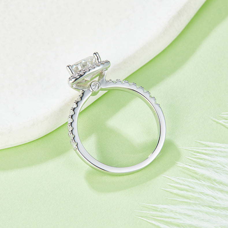 CARISSIE trillion halo engagement ring, side profile revealing the gallery accent stone and diamond-encrusted band