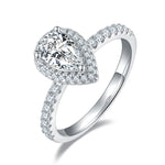 CARISSIE pear moissanite halo engagement ring, angled view showing split shank band and double halo detail
