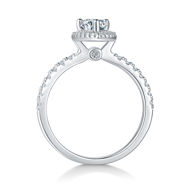 CARISSIE pear moissanite halo engagement ring, side profile revealing gallery stone and pavé band